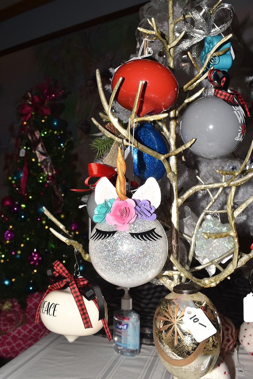 Handmade ornaments, courtesy of one volunteer's Cricut machine, sold as well.