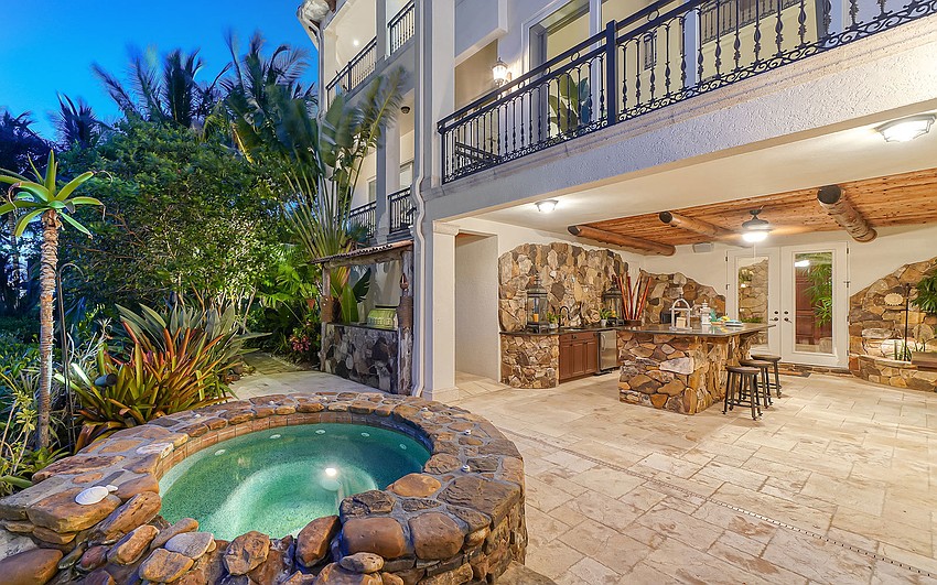 Lush landscaping surrounds the pool.