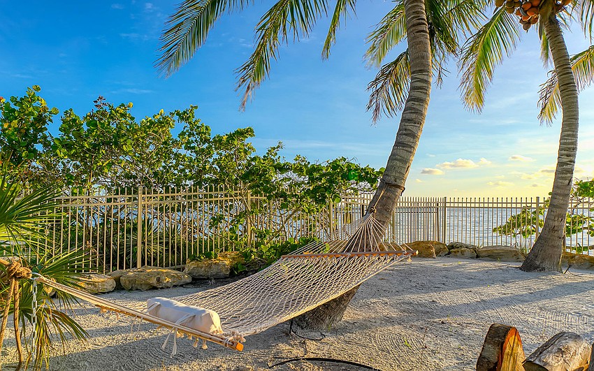The 3/4 acre property is fenced for beach privacy.