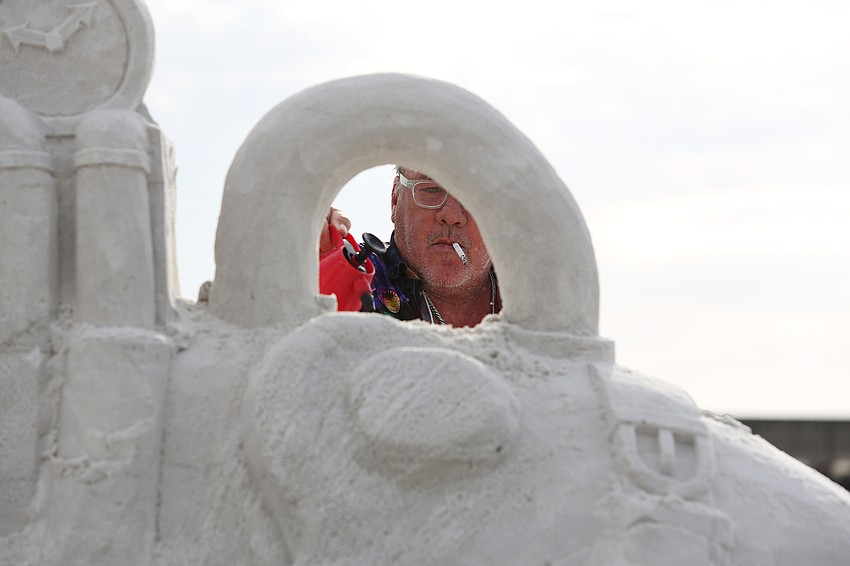 Charlie Beaulieu sculpts away on his marine life creation.