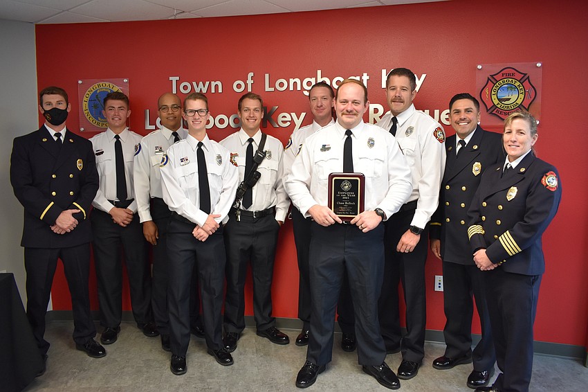 Longboat Key Fire Rescue firefighter-paramedics gather around Chase Bullock, who won the department’s employee of the year award.