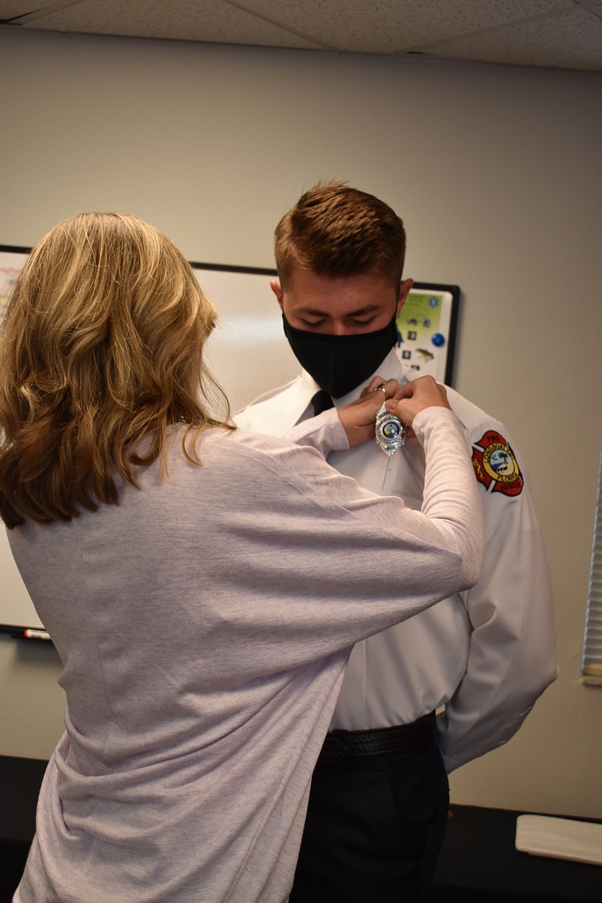 Shelley Jones pinned her son Tanner Broxson on Monday morning.
