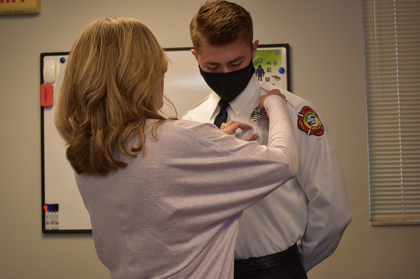 Shelley Jones pinned her son Tanner Broxson on Monday morning.