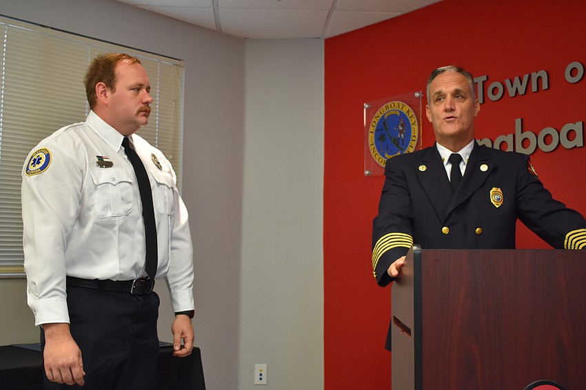 Firefighter-paramedic Chase Bullock gets recognized by Fire Chief Paul Dezzi on Wednesday morning. Bullock won the department’s employee of the year award.