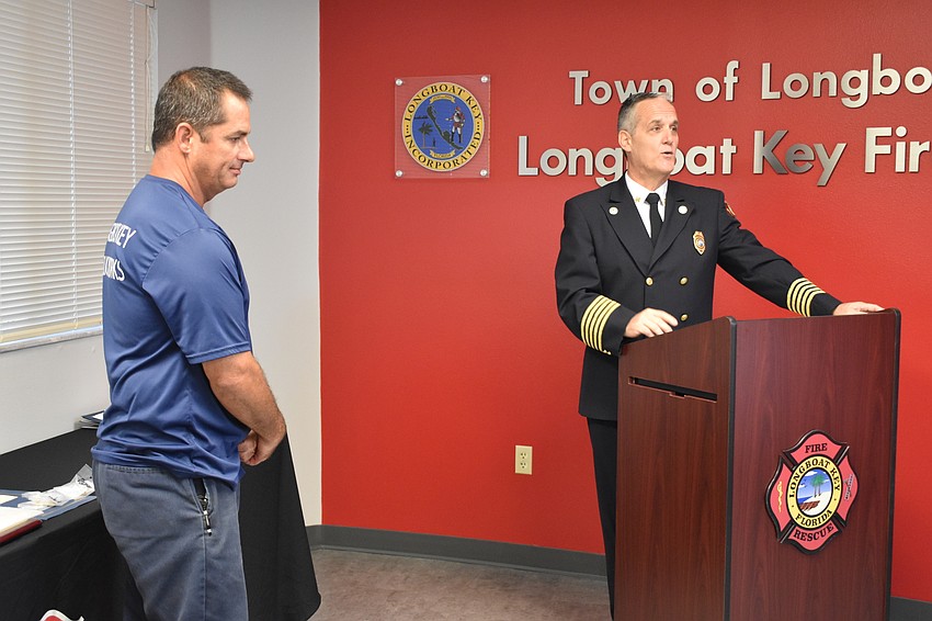 On Wednesday morning, Fire Chief Paul Dezzi (right) recognized Public Works Department equipment operator Frank Scrivani (left).