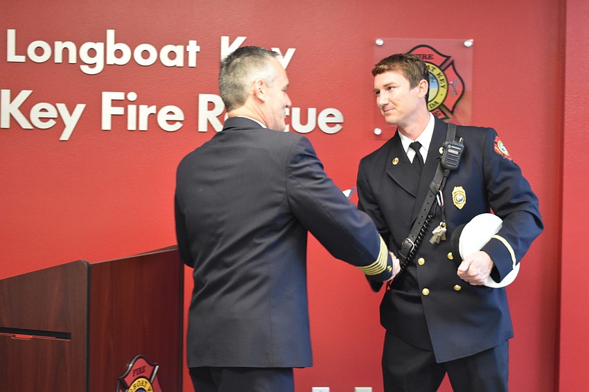 Fire Chief Paul Dezzi shook the hand of Lt. Daniel Heath on Wednesday morning. Heath has served Longboat Key Fire Rescue Department for 10 years.