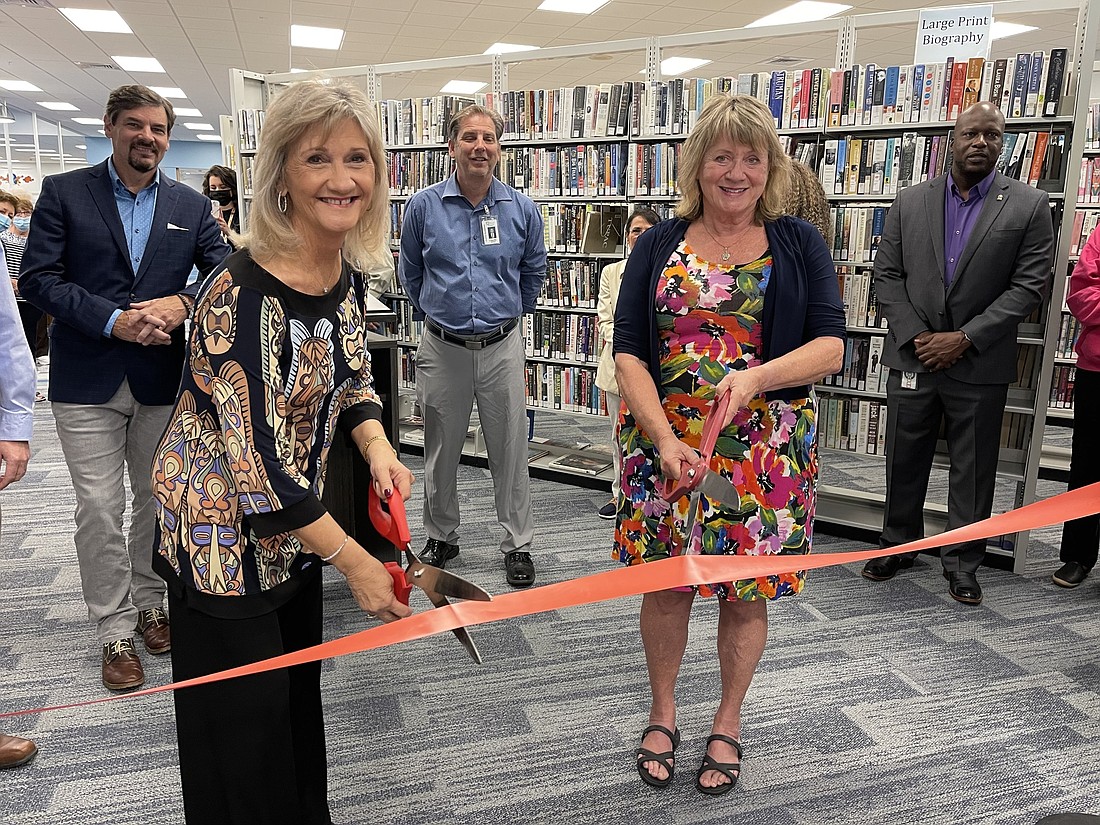 Manatee County Commissioner Vanessa Baugh and Friends of the Braden River Library President Judy Mullen cut the ribbon to officially open the new 4,250 square foot expansion to the Braden River Library on Nov. 17.