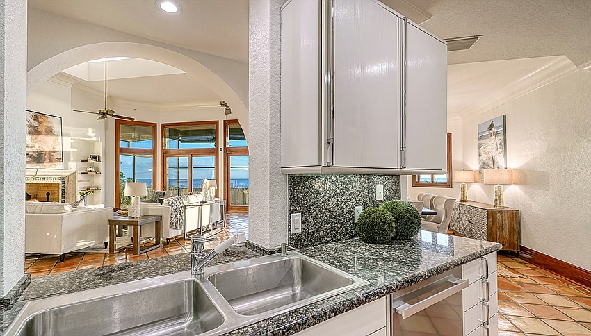 The kitchen is open to the living areas. (Courtesy Pix360)