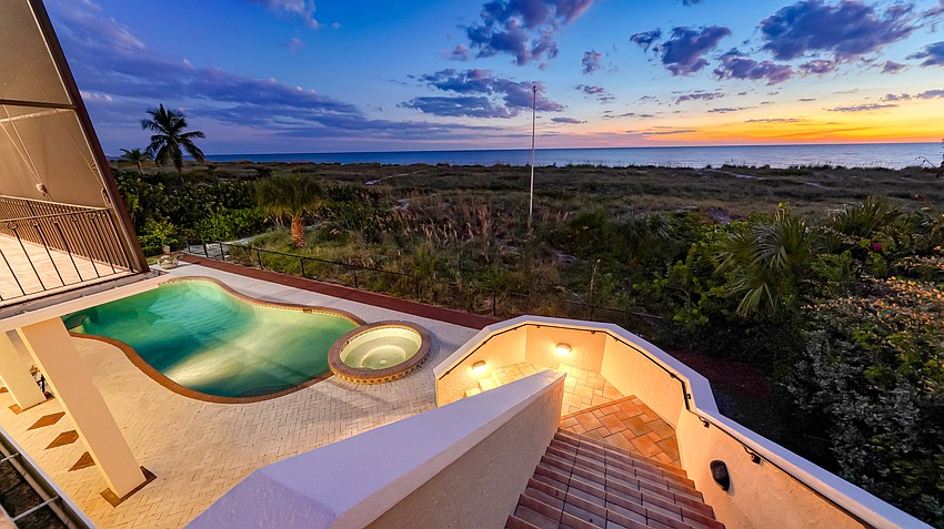 The home offers a swimming pool and spa overlooking the beach. (Courtesy Pix360)