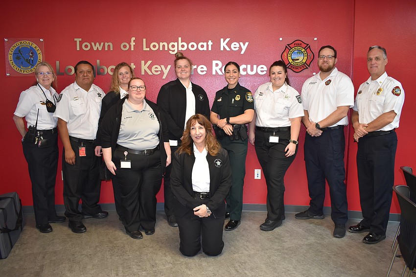 Assistant Chief Jane Herrin, Richard Cesaro, Melissa Slater, Haley Coss, Lt. Michelle DiCapuaa, Kellie Stewart, Raymond Burger and Key Fire Chief Paul Dezzi. Ashley Patrick and Jacquelyn Wynne are in front.