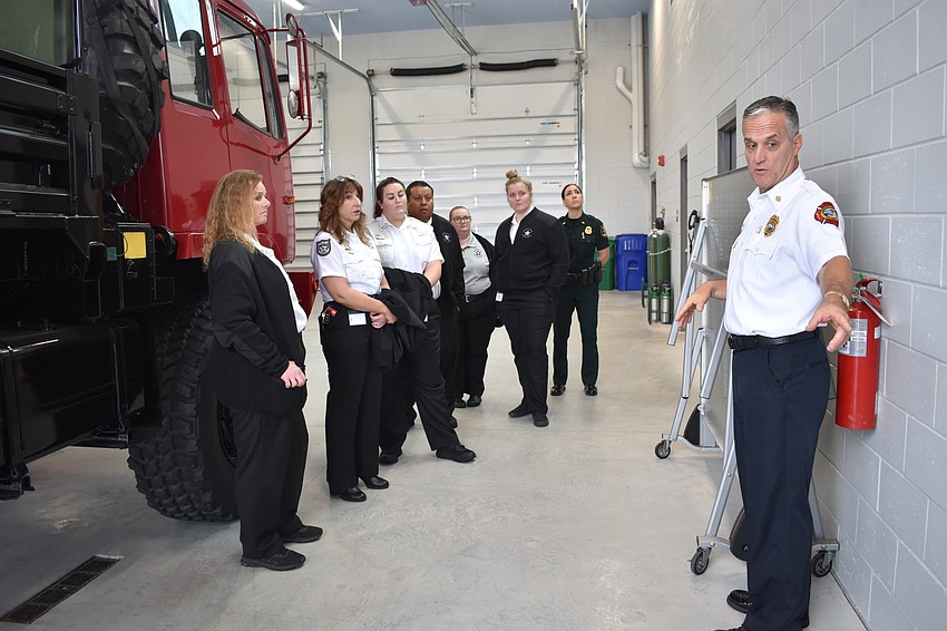 On Thursday, Longboat Key Fire Chief Paul Dezzi (right) gave Sarasota County dispatchers a tour of Fire Station 92.