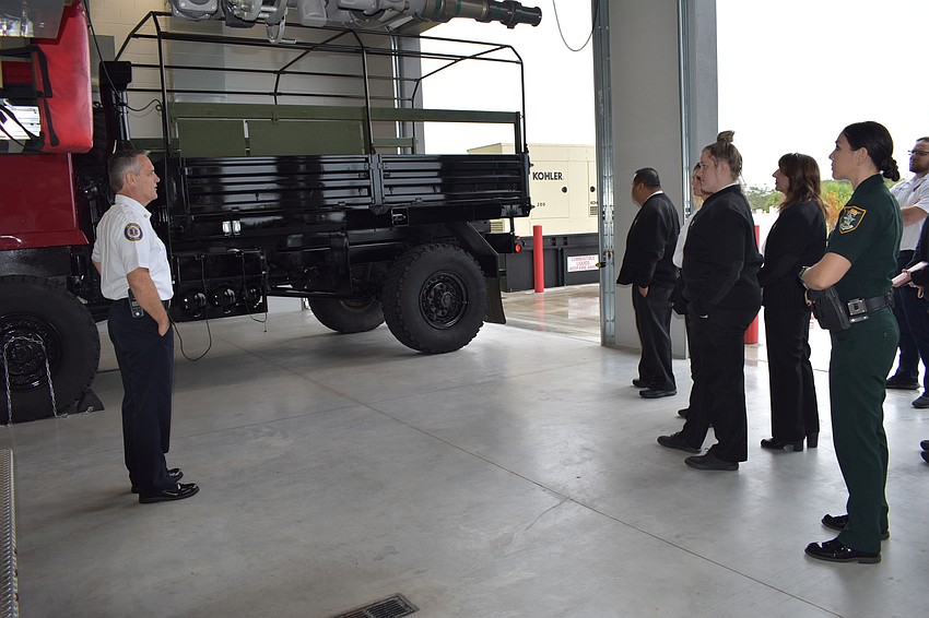 On Thursday, Fire Chief Paul Dezzi (left) gave Sarasota County dispatchers a tour of Fire Station 92.