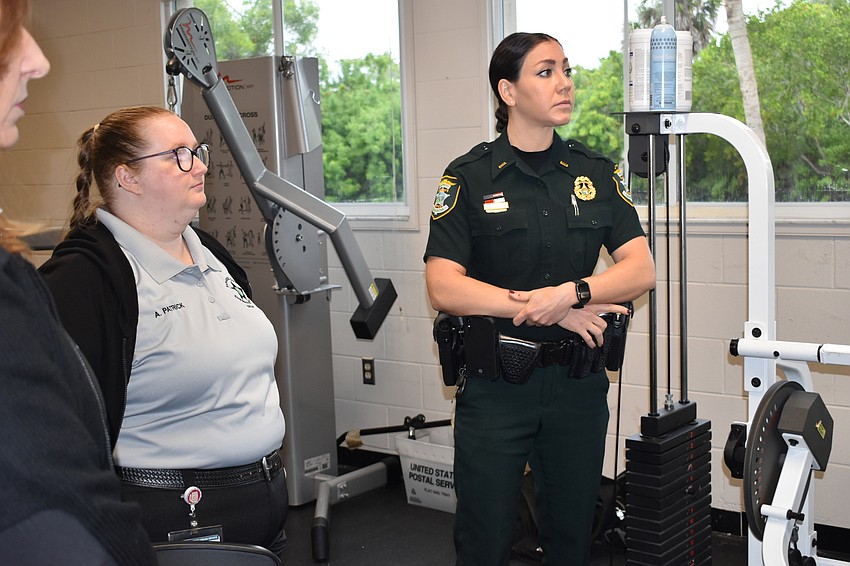 Sarasota County Communications operator Ashley Patrick (left) and Lt. Michelle DiCapua (right) got a tour of Fire Station's 91 fitness facility.