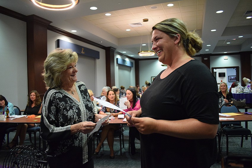 Lakewood Ranch's Zita Grepling and Courtney Fletcher, who is visiting from Connecticut, tie for winning a round of bingo and wait for a tie-breaker.