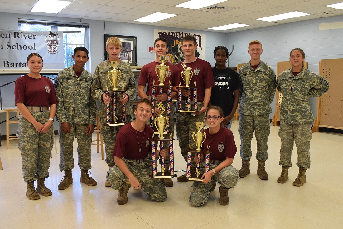 Members of the Braden River High School JROTC Raiders team celebrate their success at the state competition.