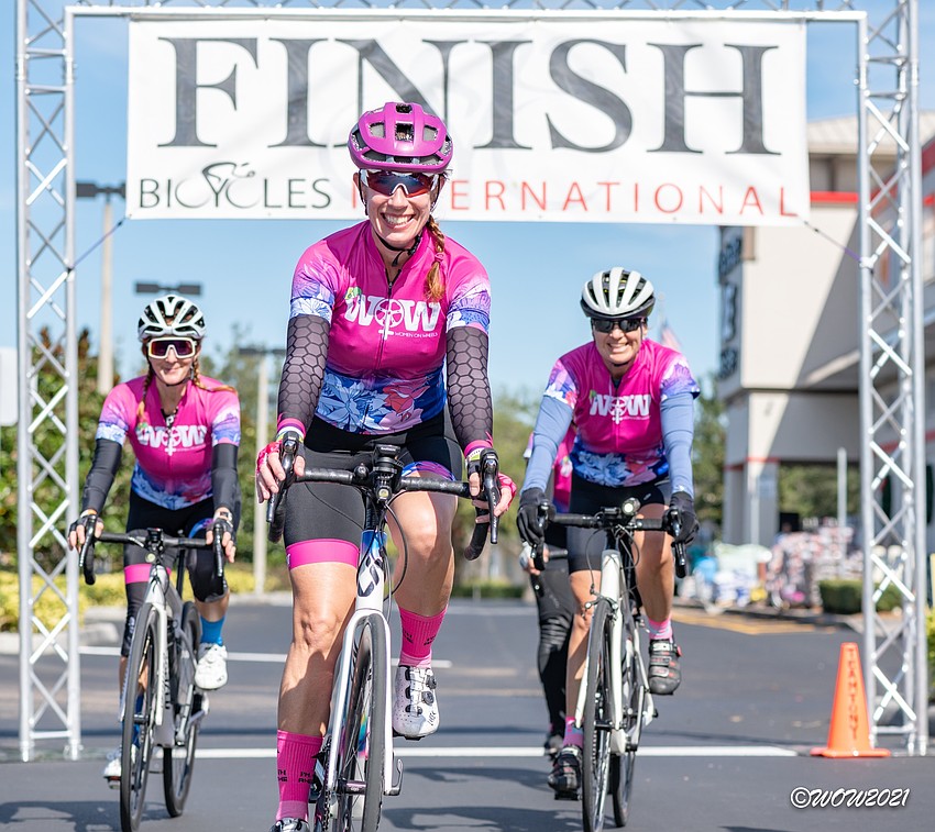 Sarasota's Ann Drummond and East County's Dawn Zielinski and Andrea Sacchetti cross the finish line of the Women on Wheels' annual charity ride. Courtesy photo.