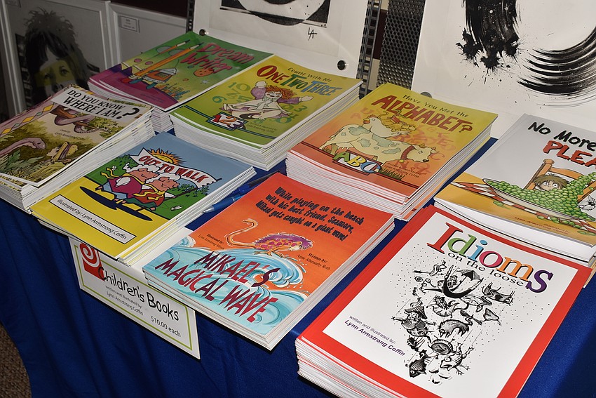 Lynn Armstrong Coffin had children's books that she's illustrated for sale.