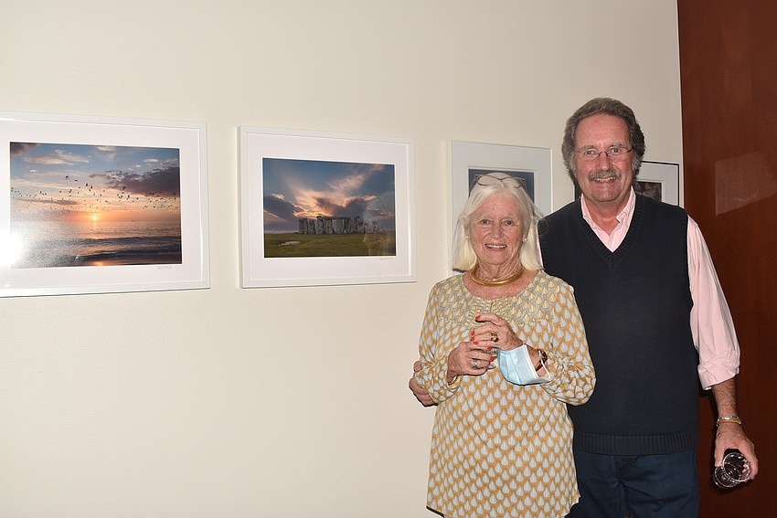 Sandy and Patrick Bogert with Patrick's photos.