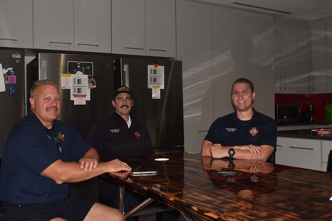 Firefighter-paramedic Ron Koper, Lt. Alan Jenkins and firefighter-paramedic William Lewis, who will be working the Thanksgiving shift.
