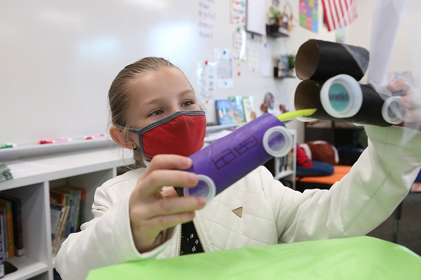 Taylor WIlliams plays with the trains she made.
