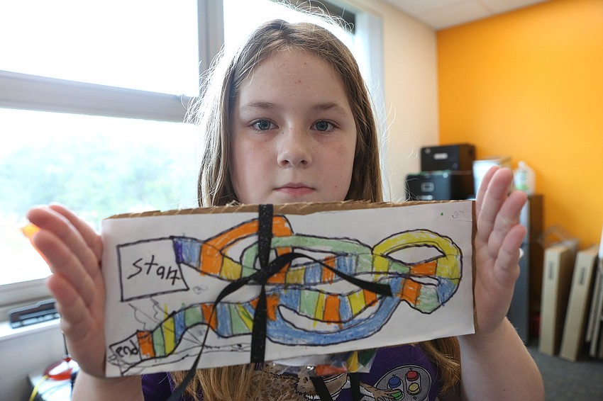 Emmalyn Medvecky created her own Dragons and Dice board game.