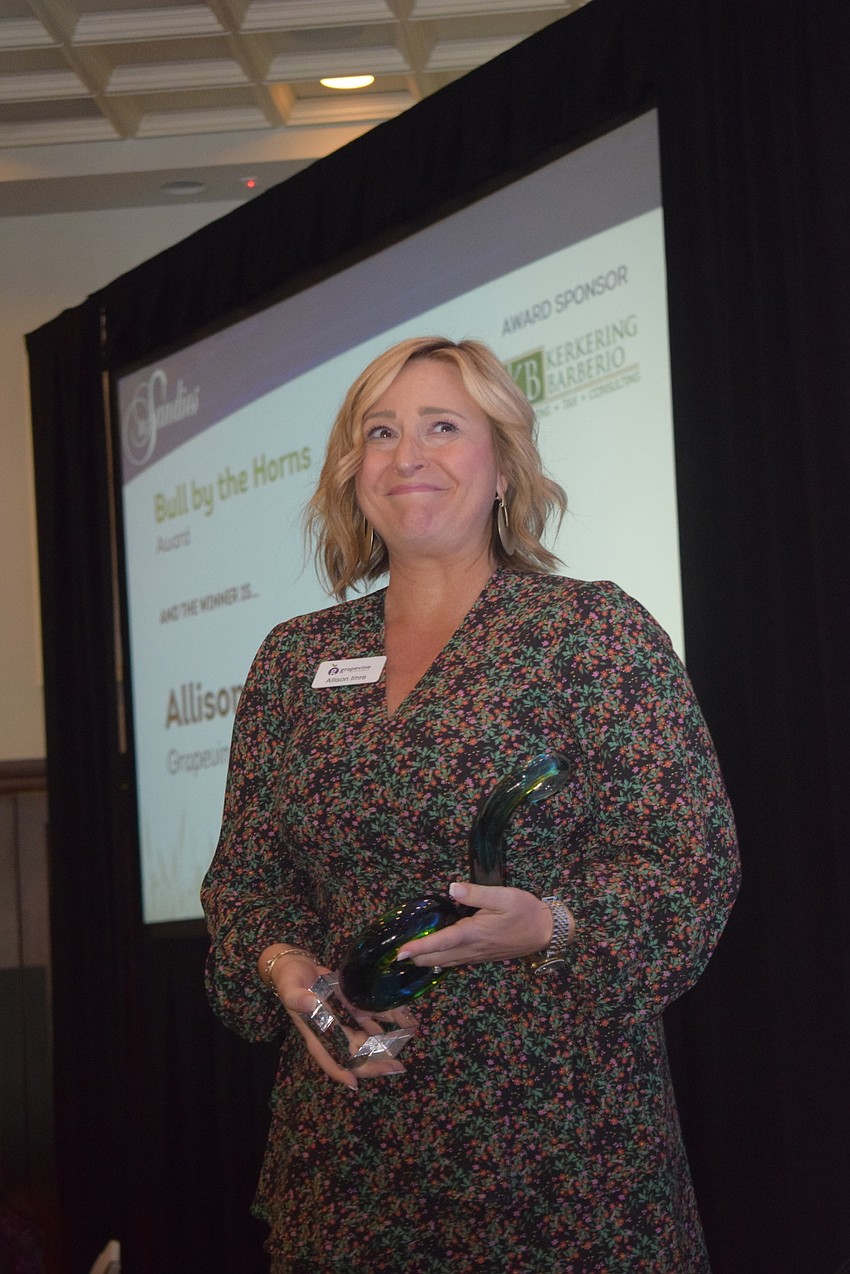 Allison Imre Perkowski of Grapevine Communications, accepts her Bull by the Horns award.