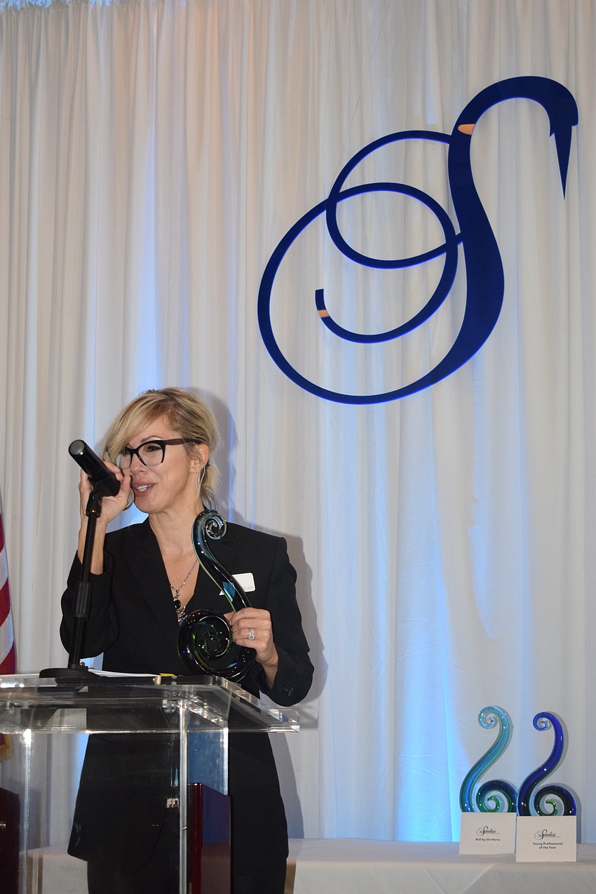 Karen Medford of Sirius Day Spa addresses the crowd after winning the Networking Queen award.