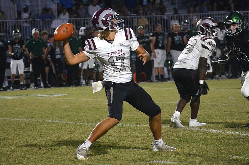 Rams sophomore quarterback Jeremiah Dawson throws a touchdown pass to senior Jaron Glover in the third quarter.