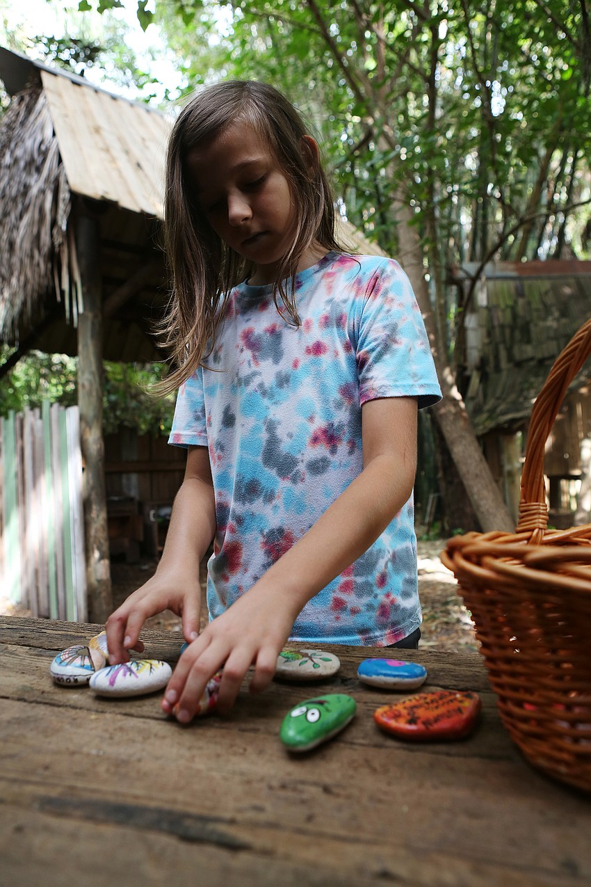 Sky Adams organizes his rocks.