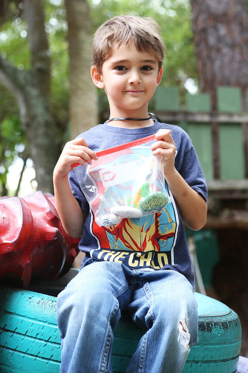 Nicholas Morales rests with his collection.
