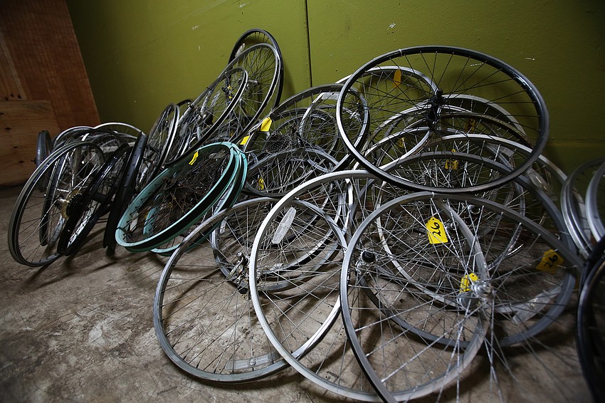 The group has plenty of spare bike parts in the storage area.