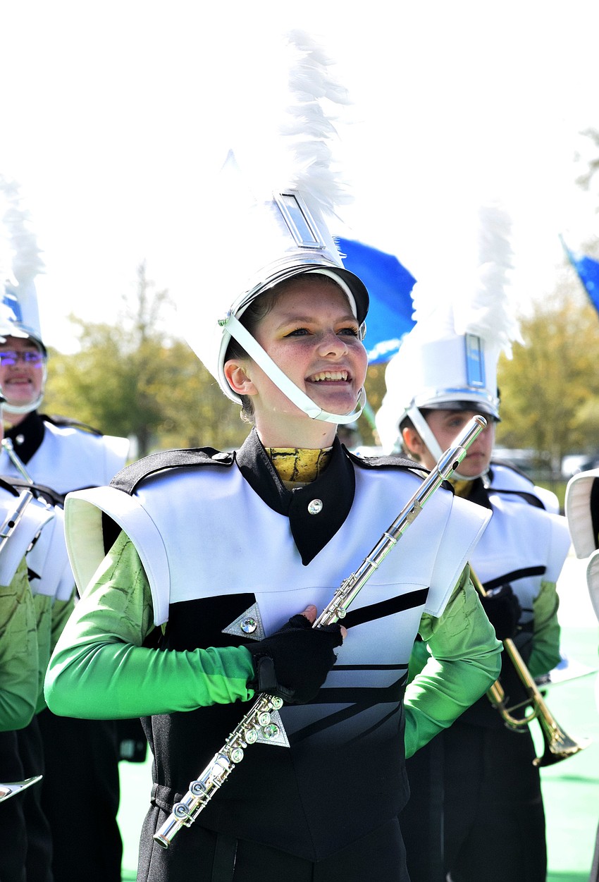 Kaley Hammock with Lakewood Ranch High School smiles at the crowd as the band finishes its performance.