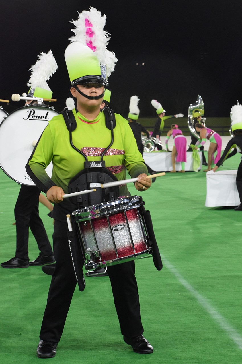 Braden River's Daniel Rumbo plays snare drum with the drumline.