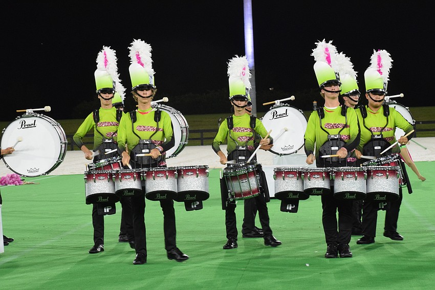 Members of the Braden River High School drumline drive the beat in the performance.
