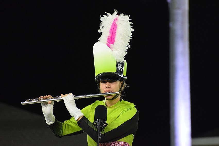 Braden River's Cara Bailey plays flute at the beginning of the performance before switching to piccolo.