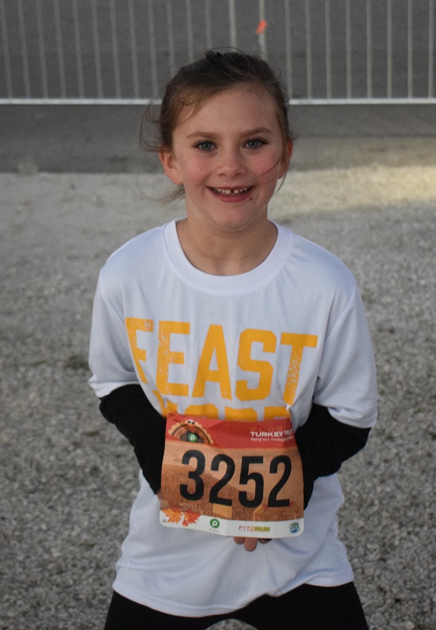Sarasota 6-year-old Rian Dunn dances to the music before the start of the Florida Turkey Trot at Nathan Benderson Park.