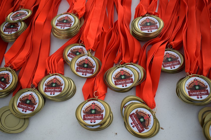 After finishing, the runners picked up a medal for the event.