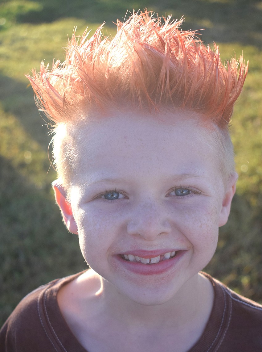 Parrish's Evan Fulton, 10, has a hair color to match the season. He ran in the 5K.
