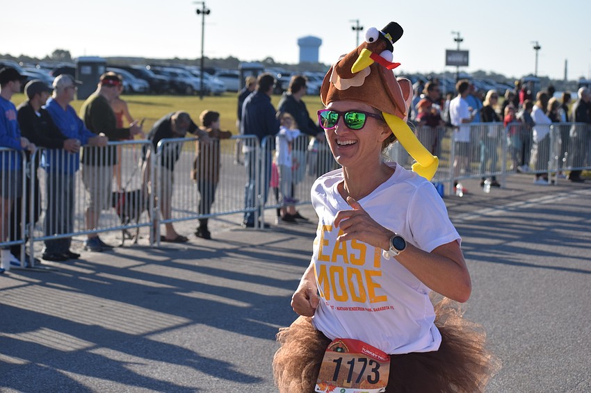 Heather McFarland wore a turkey on her head during the 5K. She says it was 