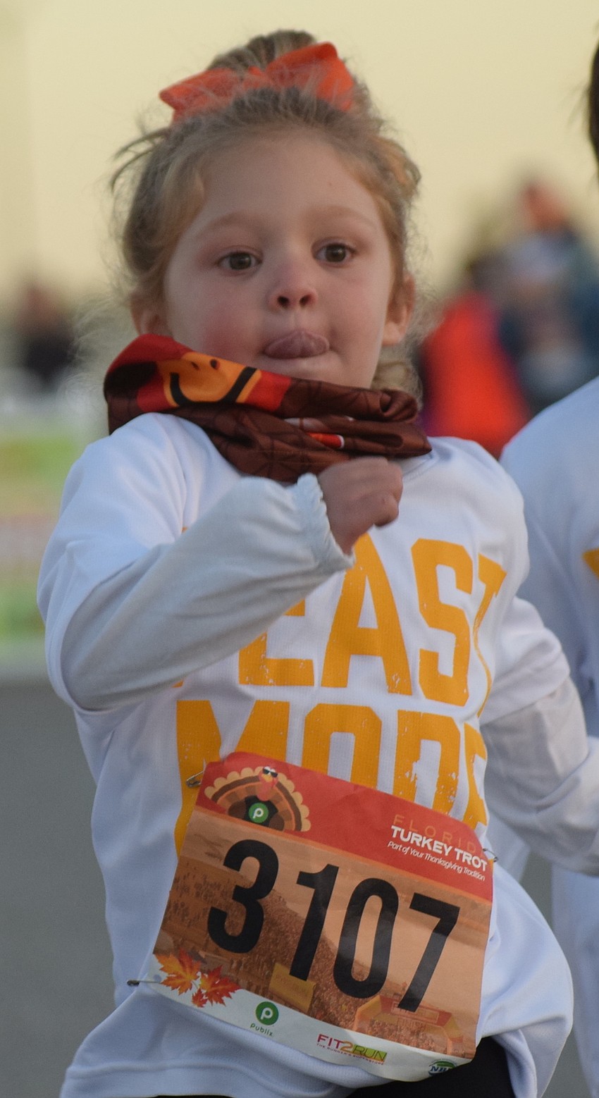 Jane Goins, 3, of Sarasota gives her all in the Kids Turkey Dash.
