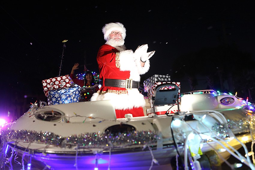 Santa Claus waves to enormous cheers and applause.
