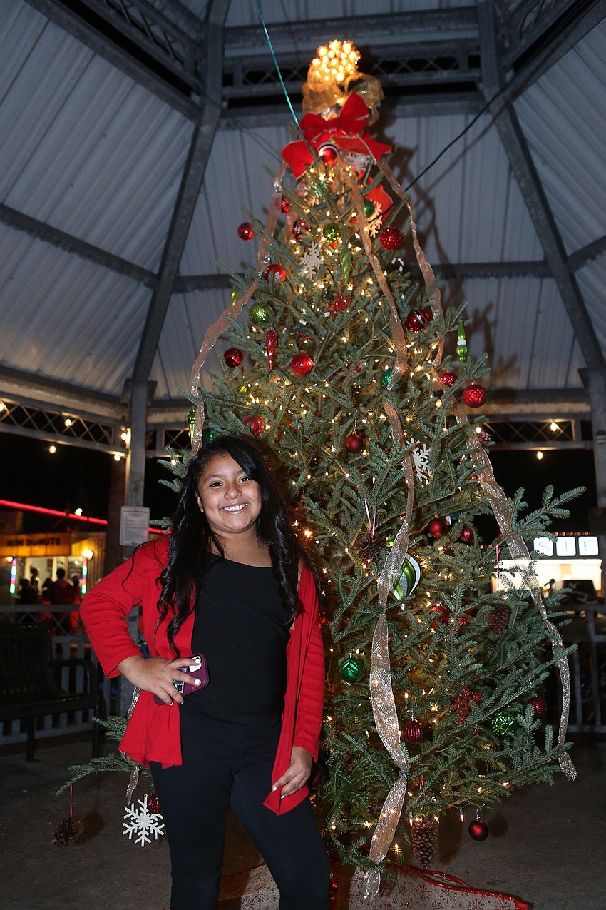 Andrea Loredo poses with the tree.