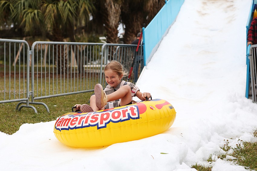 Kayla Bieliaev slides down the ice slide at A Taste of Chanukah on Nov. 28, 2021.