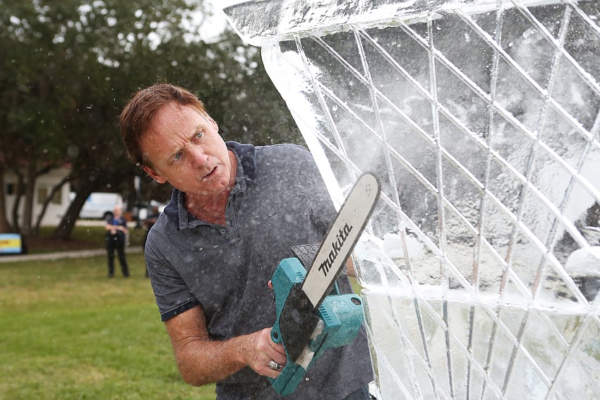Matthew Walsh works on his ice sculpture.