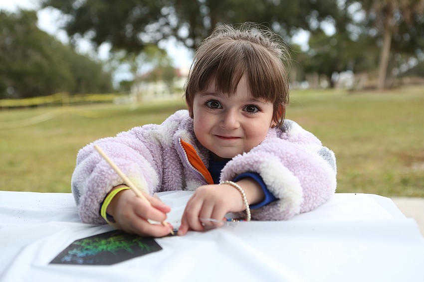 Ella Steinmetz colors a dreidel.
