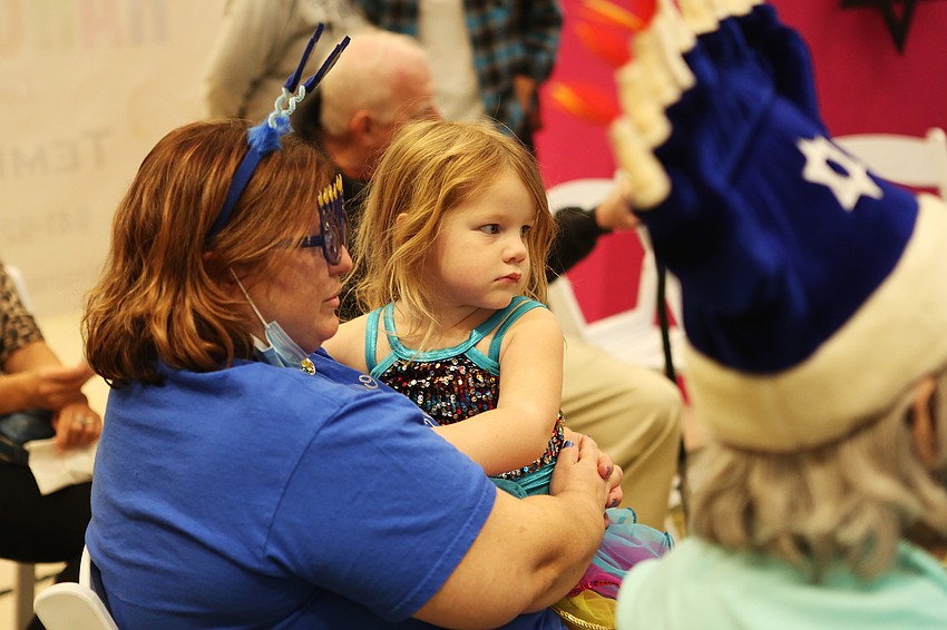 Penelope Chipurnoi listens to the story.