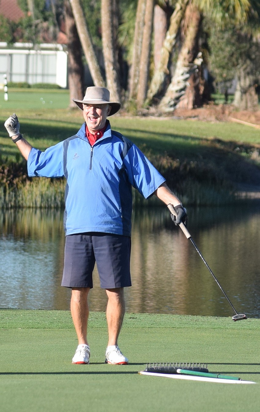 Palm Aire resident Bill Wachter reacts after rolling in a long putt.