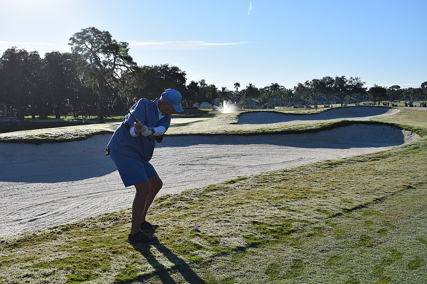 Don Stone drives the ball down the 18th fairway. Stone was the only one in his foursome not to hit the ball in the bunker on that hole.