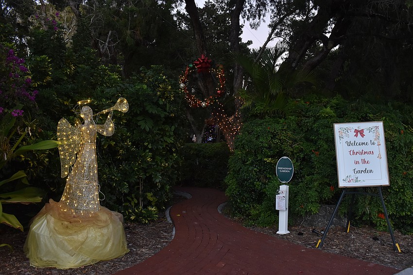 The entrance to the garden has an angel heralding the spectacle inside.