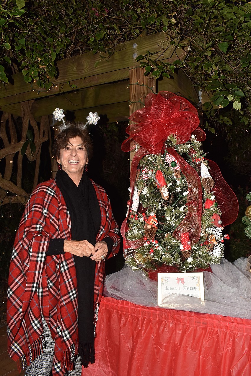 Lesley Rife next to her daughter Stacey Wurthmann's tree.